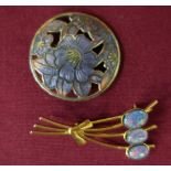 Circular enamel floral pattern brooch and a gilt metal and three stone brooch stamped 925 (2)