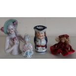 Small Toby jug, large pincushion porcelain dolls head, another similar and a small doll in tartan
