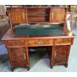 Victorian walnut desk, the raised back with two tier open centre flanked by two panelled cupboard