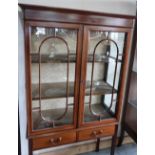 Edwardian mahogany inlaid cabinet enclosed by two glazed doors with two drawers to the base, on