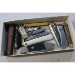 Box containing a selection of various assorted vintage and other pocket knives