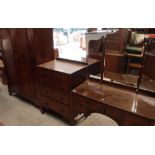 Three piece walnut bedroom suite comprising of double door wardrobe, dressing chest, and chest of
