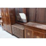 Circa 1930s oak three piece bedroom suite comprising of double door wardrobe, dressing chest with