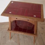 Early 20th C rectangular two tier oak occasional table with inset tiles, on square tapering supports