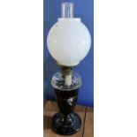 Large late Victorian oil lamp with black glass base, clear glass reservoir and opaque glass shade (