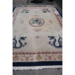 Extremely large Chinese woollen blue and beige ground dragon pattern rug (270cm x 380cm)