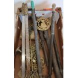 Box containing various assorted brass ware including sprayers, decorative swords, horse brasses etc