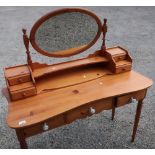 Modern pine dressing table with raised mirror back and three drawers, on turned supports (width