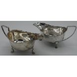 Pair of Walker and Hall Sheffield silver hallmarked sauce boats no.65550 on three supports