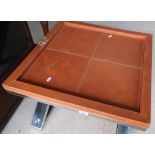 Modern design leather square top coffee table with polished steel X shaped base (60.5cm x 60.5cm x