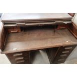 Edwardian oak twin pedestal roll top desk with fitted interior (width 122cm)