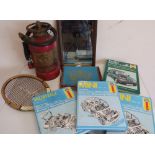 Vintage tennis racket, reproduction French advertising mirror, various Haynes car service manuals,