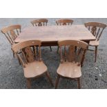 Pine rectangular farmhouse style kitchen table on turned supports and a set of six beech farmhouse