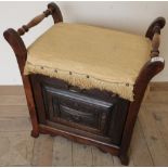 Late Victorian rectangular piano stool with carved and paneled fall front with sectioned interior