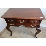 Quality reproduction mahogany low boy with central drawer flanked by four further short drawers (