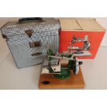 Cased Grain mini hand operated sewing machine with original cardboard box and outer case