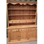 Modern waxed pine dresser with three tier raised back with four drawers above three long drawers and