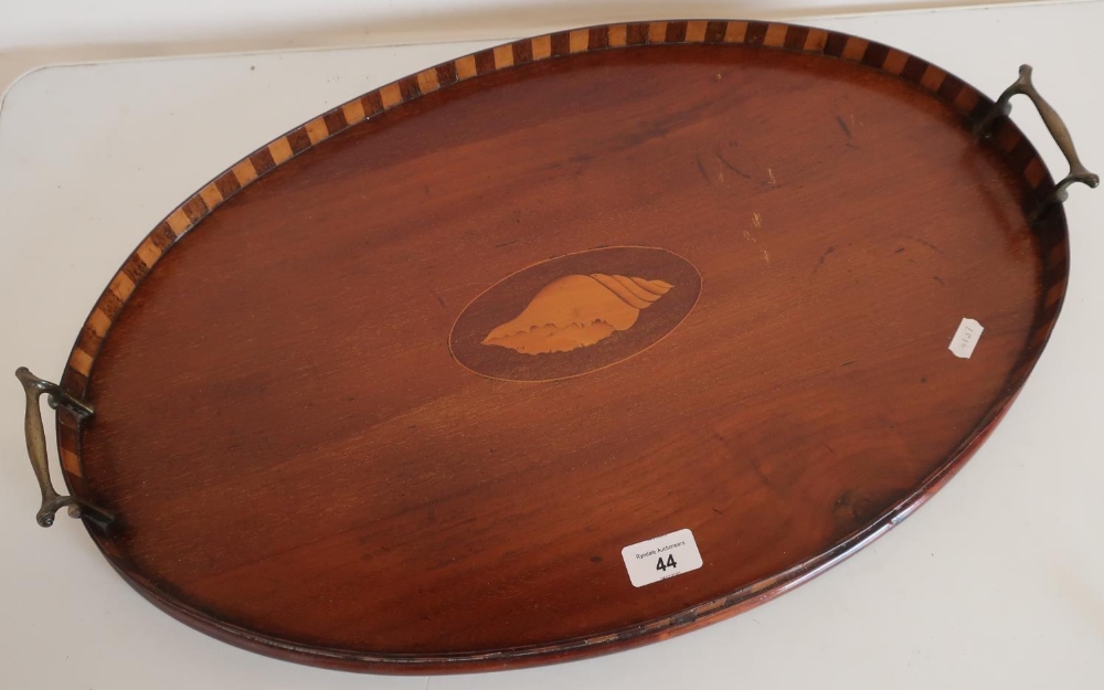 Edwardian mahogany inlaid oval twin handled tray with raised sides and central inlaid shell