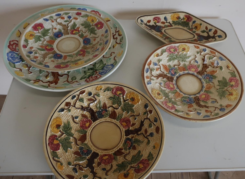 Selection of five various assorted tree and floral pattern chargers and plates