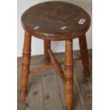 Elm circular top country style stool with X shaped understretcher and turned supports
