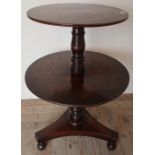 Victorian mahogany two tier dumb waiter, circular sections on turned column and three supports (