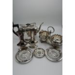 Group of silver plated items including large teapot, twin cruet set, pair of vases, butter dishes