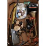 Scales hanging pan, various golf balls, carved wood items, vintage Polaroid camera, John Player