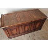 Oak blanket box with panel and linen fold detail (106cm x 45cm x 52cm)