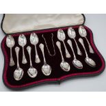 Cased set of twelve silver hallmarked teaspoons and sugar tongs set stamped 925 with makers mark G.