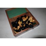 Rectangular mahogany box with hinged top containing a turned wood chess set (complete)