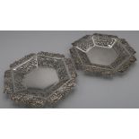 Pair of Chinese silver dishes with pierced floral borders (diameter 11cm) with signature panel to