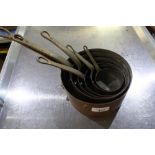 Set of six graduating copper pans