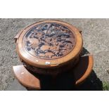 Oriental carved hardwood circular occasional table with carved detail to the top and glass panel,