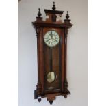 Walnut cased double weighted Vienna style wall clock