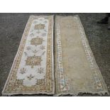 Two Indian wool runners, beige ground with three central medallions (one very worn) (275cm x 75cm)