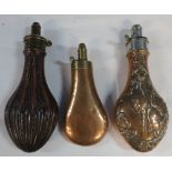 Group of three powder flasks including small plain bag shaped brass and copper bodied, G and JW