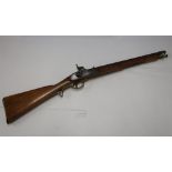 A British percussion cap carbine with 20 inch barrels, fixed fore & aft sight, with brass mounts and