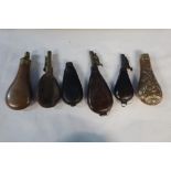 Three 19th C leather bodied shot flasks, leather bag for a shot flask and embossed oak leaf and