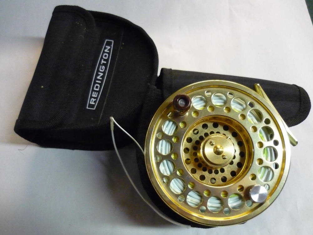 Redington AL 13-14 salmon fishing reel, gilt finish with spare spool, in makers pouches (2)