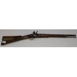 Flintlock carbine with 22 inch barrel with brass mounts and butt compartments with steel ramrod, the