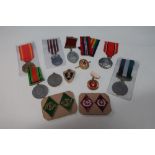 Group of various medals and commemorative medals, cap badges etc including 39-45 War and Defence