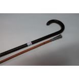 19th/20th C lignum vitae walking stick (length 85.5cm) and an early 20th C swagger cane with white