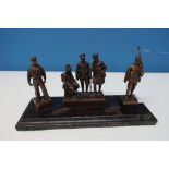 Group of cast bronze British and Colonial c.WWI figures including central group of three flanked