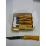 Box of seven as new Opinel 7 pocket knifes