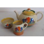 Clarice Cliff Bizzare Crocus pattern trio comprising: teapot, milk jug and sugar basin