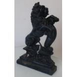 A cast metal doorstop in the form of a Helraldic rampant lion with shield, (35cm)