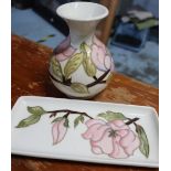 Small Moorcroft mallet shaped vase decorated with pink foliage and green leafage on a white ground