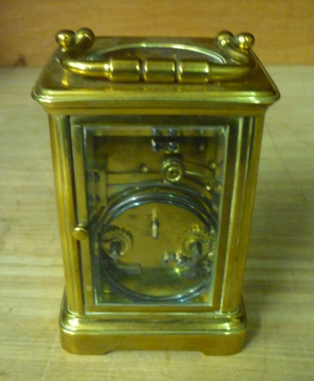 Early 20th Century brass carriage clock, bevelled glass panels with white roman dial, twin train - Image 2 of 2