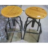 Pair of modern metal framed circular wooden topped adjustable bar stools