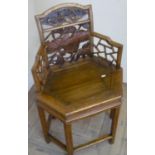 Early 19th/20th Century Chinese corner type armchair with carved fretwork centre and further